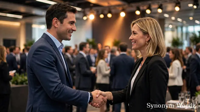 Two professionals shaking hands at a bright business networking reception