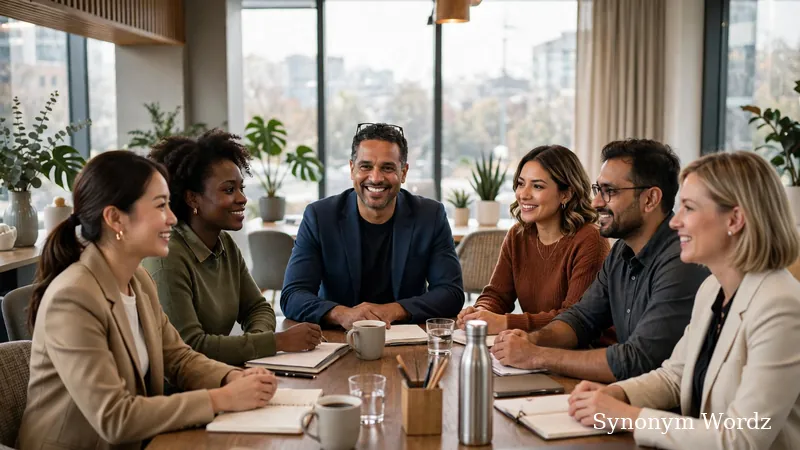 Smiling team leader mentoring diverse professionals during a collaborative meeting