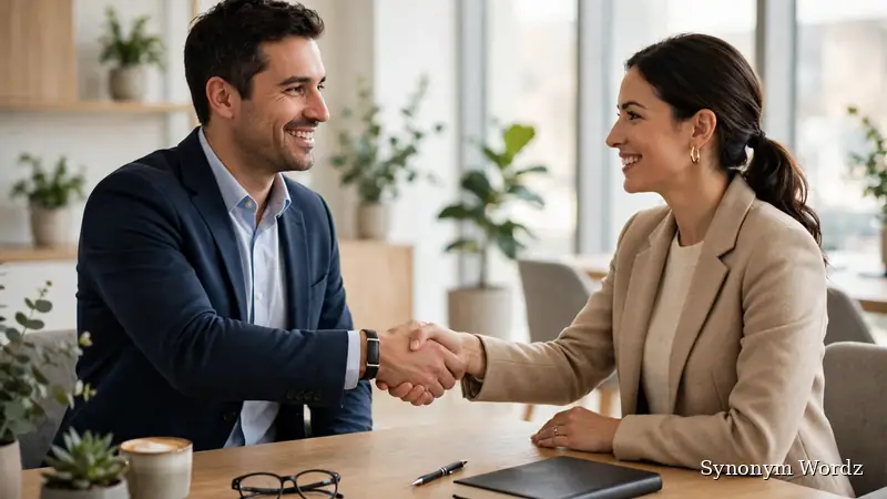 Two professionals shaking hands in a modern office