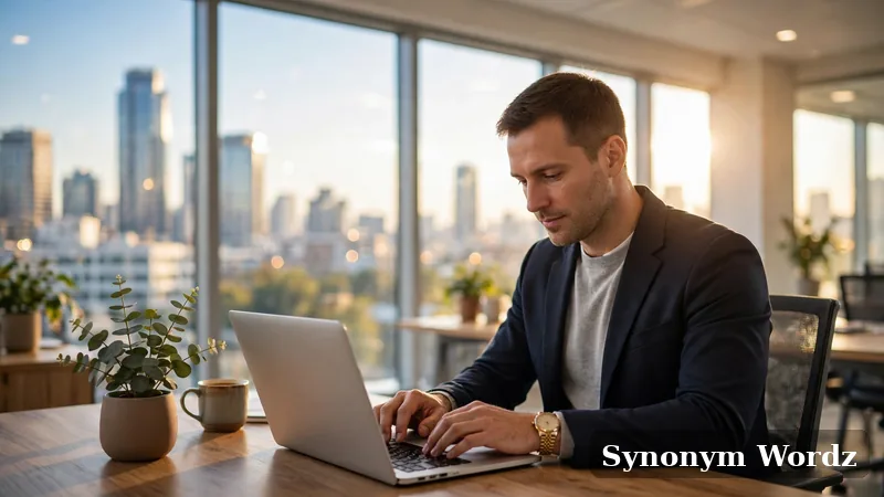 Professional writing a business email on a laptop