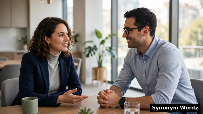 Two colleagues having a polite and calm professional conversation in a bright modern office