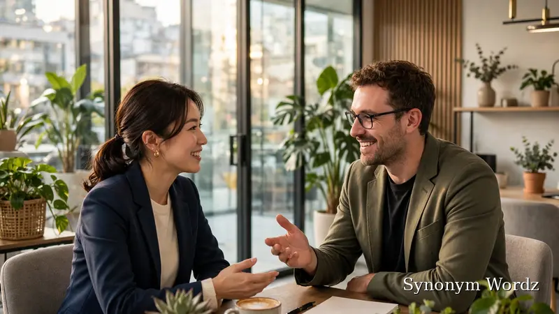 Two professionals discussing business communication options in a bright modern office